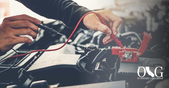 mechanic working on car engine