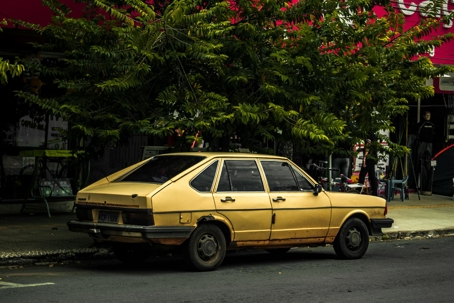 old yellow car on road